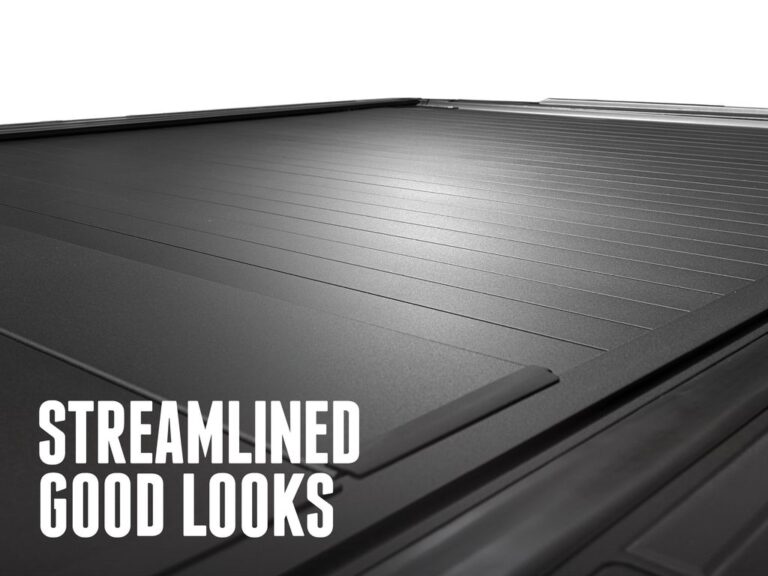 RealTruck FlushFit TS closed matte black cover sitting flush below the bed rails, STREAMLINED GOOD LOOKS text overlay on top of the cover