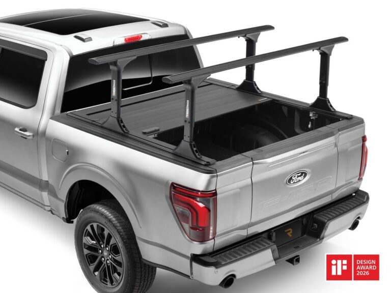 RealTruck RetraxPRO EZ-OFF FRC-4000 retractable tonneau cover removed and a truck bed rack system installed on a silver Ford F-150, demonstrating the EZ-OFF quick-click removal feature