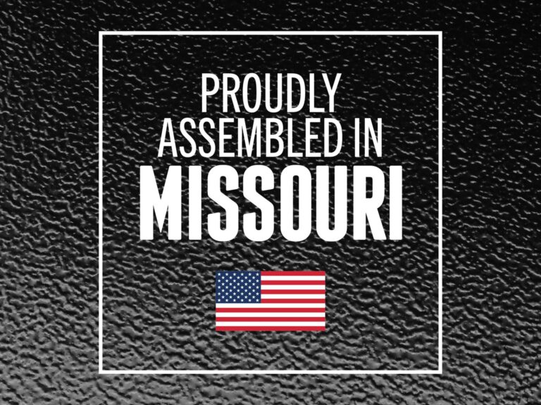 BAKFlip G2 proudly assembled in Missouri badge with American flag on textured metal background