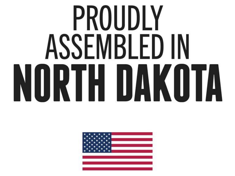 RetraxPRO EZ-OFF cover proudly assembled in North Dakota badge with American flag on a textured metal background, MADE IN AMERICA label