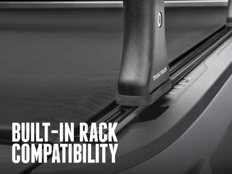 RealTruck TruXedo Pro X15 TS close-up of the T-slot rail system accepting a standard crossbar mount, demonstrating the 15-degree side rail angle