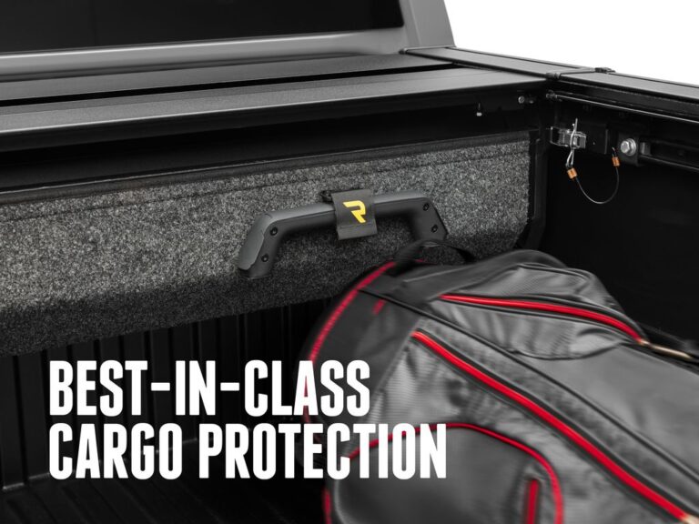 RetraxPRO EZ-OFF cover canister on a workbench with foam padding, demonstrating the BEST-IN-CLASS CARGO PROTECTION soft-impact storage case