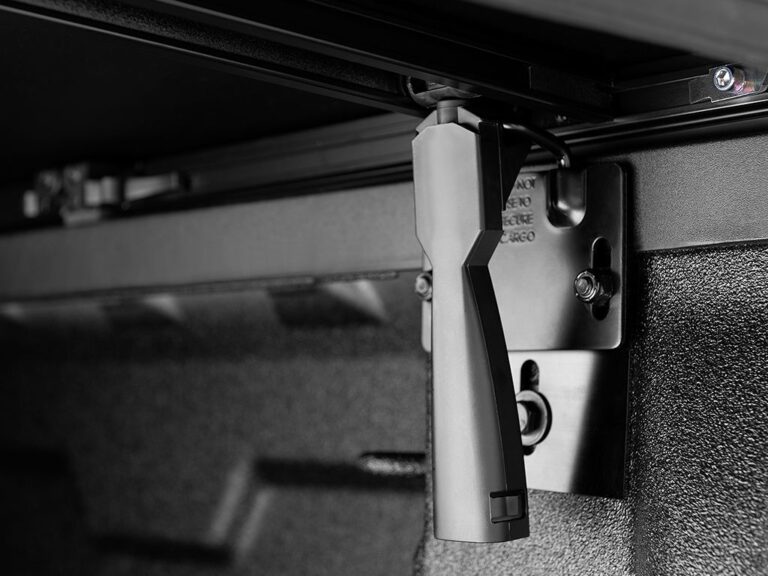 Extang Trifecta Signature 2.0 patented corner-tuck system close-up showing the canvas-wrapped aluminum frame edge on white background