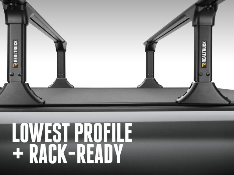 BAK Revolver X4TS marketing claim image reading LOWEST PROFILE + RACK-READY showing the cover sitting nearly flush with the bed rails on a silver truck