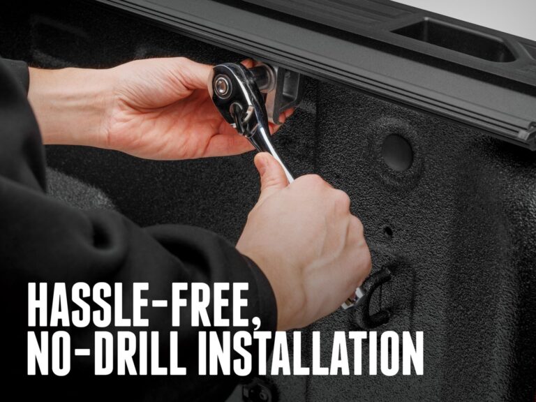 BAKFlip G2 no drill installation showing hands tightening a clamp on the bed rail with a wrench