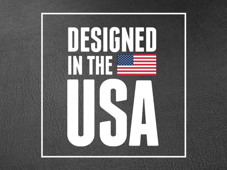 Black textured leather background with a white border framing the text "DESIGNED IN THE USA" and an American flag graphic.