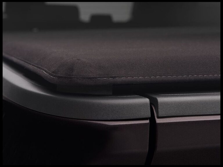 Extang Trifecta Signature 2.0 panoramic overhead view of the fully closed cover sitting flush with the truck bed rails, showing the triple-fin perimeter seal