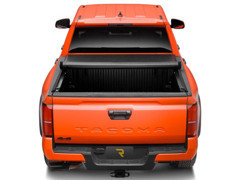 RealTruck x TruXedo Lo Pro close-up showing the side seal and bed rail attachment on a truck