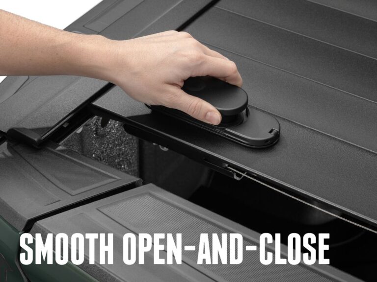 RetraxPRO MX TraxLatch comfort handle close-up with a hand operating the latch, SMOOTH OPEN-AND-CLOSE marketing overlay