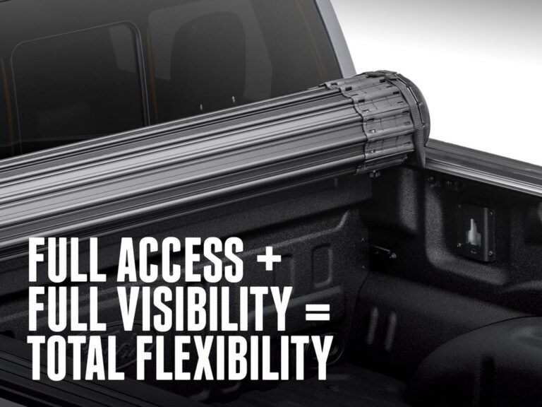 BAK Revolver X4S cover rolled at the bulkhead on a black truck showing full bed access from the tailgate view, with text overlay reading full access full visibility total flexibility